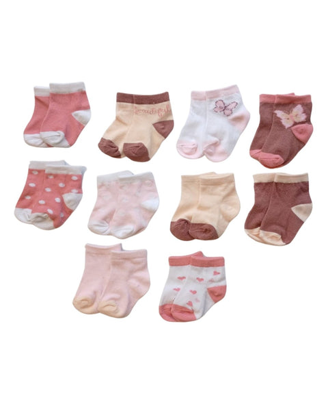 Paquete de 10 calcetas Le Top para bebé niña, diseños surtidos en tonos rosa, café y crema.