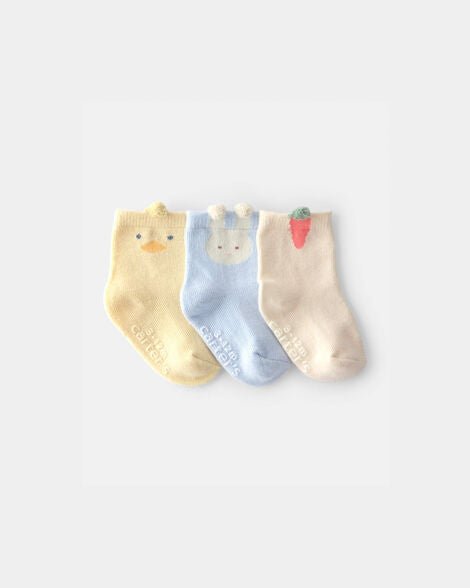 Pack de 3 calcetines Carter's unisex para bebé con diseños de patito amarillo, conejito azul y zanahoria crema. Suaves y antideslizantes.