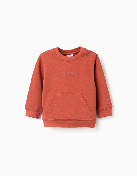Sudadera de felpa Zippy para bebé en naranja terracota, con bolsillo canguro y cuello redondo.