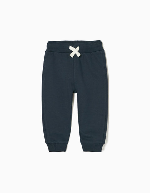 Pantalón jogger Zippy de felpa azul oscuro para bebé, vista frontal con lazo decorativo crema.