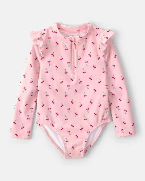 Calzoneta Carters rosada de cerezas manga larga con vuelitos para niña. Protección solar y estilo.