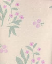 Primer plano de la tela de los leggings Carter's con estampado floral en tonos rosa y verde menta