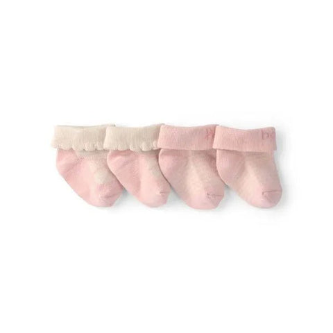 Set de dos pares de botitas Carter's en tonos rosa claro y crema, dispuestas horizontalmente sobre