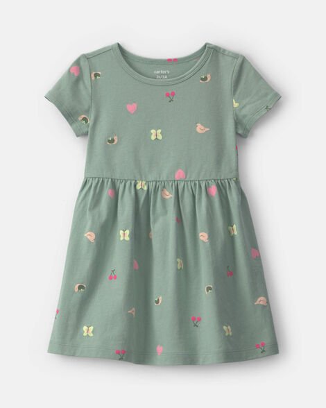 Vestido verde tejido Carter's para niña con estampado de mariposas, corazones y frutas de frente.