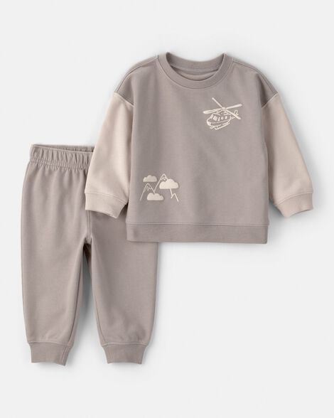 Conjunto Carters de sudadero y jogger color beige para niño con diseño de helicóptero y montañas.
