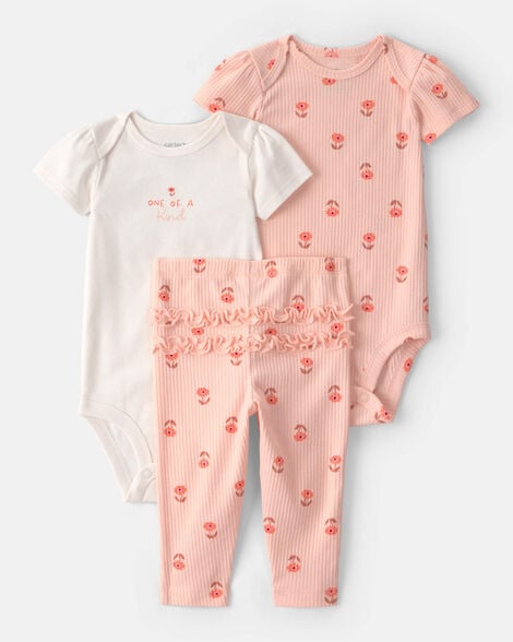 Conjunto de bebé Carter's de 3 piezas: body blanco "ONE OF A KIND", body y pantalón rosa floral con volantes.