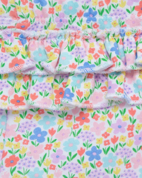 Detalle de leggings con estampado floral vibrante y volantes, conjunto Little Me para bebé