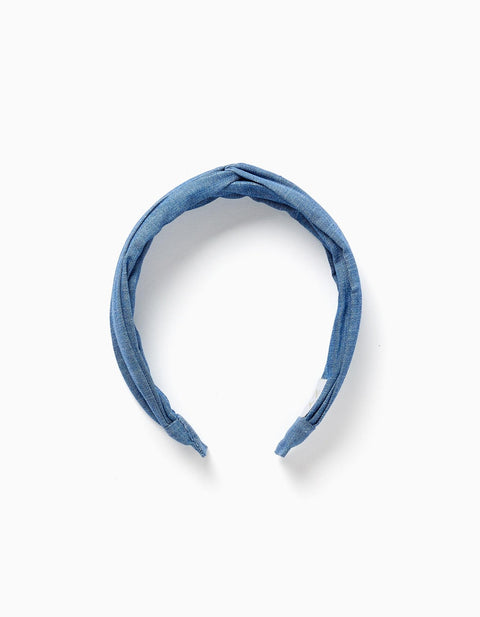 Diadema denim azul Zippy con diseño anudado, vista superior sobre fondo blanco.