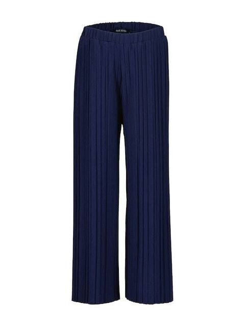 Pantalón plisado azul marino para niña Blue Seven, vista frontal con cintura elástica.
