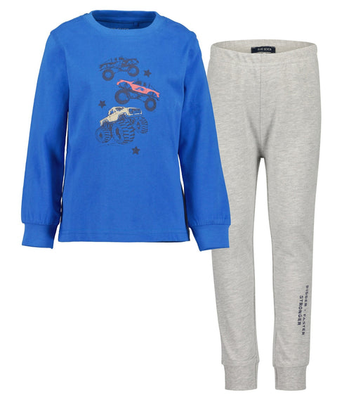 Pijama Blue Seven de niño: camisa azul con monster trucks que brillan y pantalón gris cómodo.