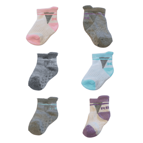 Set de 6 pares de calcetas RBX para niña con diseños variados y puntos antideslizantes en la suela.
