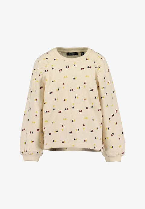 Suéter Blue Seven beige para niña con estampado de triángulos amarillos y vino, manga abullonada.