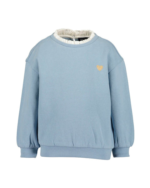 Suéter celeste Blue Seven para niña con hombros caídos, cuello con olanes y corazón bordado.