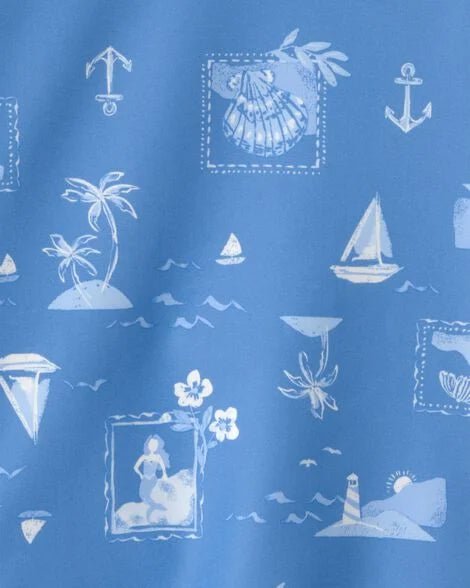 Detalle del estampado de traje de baño Carters niña: motivos marinos y playeros en azul.