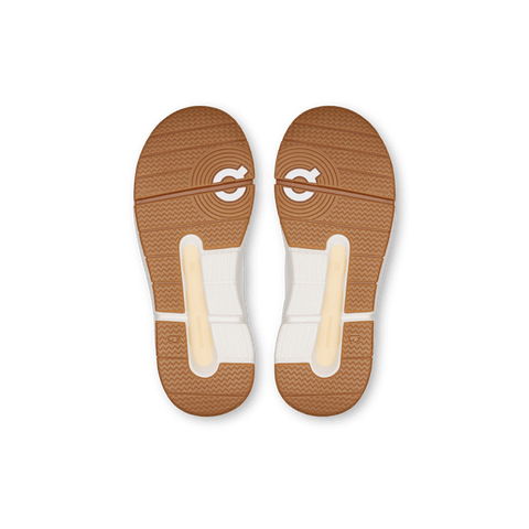 Suela de caucho de los Zapatos On Roger Kids blancos y marfil, con diseño de tracción mejorada.
