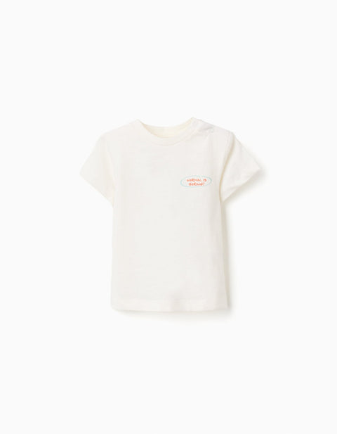 Camiseta Zippy para bebé niño, color beige claro, con estampado 'Normal is Boring!' en el pecho.