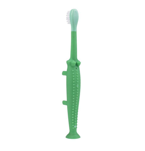 Cepillo de dientes verde con forma de cocodrilo Dr. Brown's para bebé, con cerdas suaves.