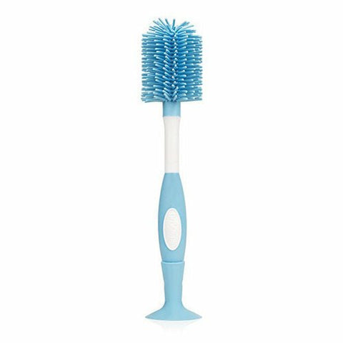 Cepillo suave de silicona celeste Dr. Brown's para limpiar pachas y biberones, con base de succión.