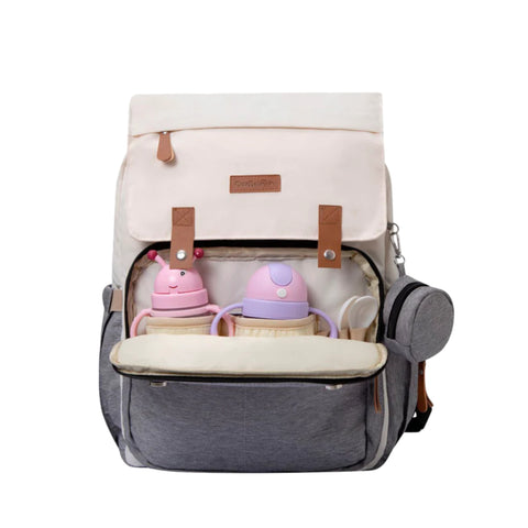 Pañalera Cute Babies tipo mochila con 4 bolsas internas y 2 laterales color gris y blanco.