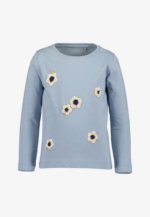 Blusa Blue Seven manga larga diseño de flores color celeste para niña