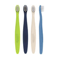 Cuatro cepillos de dientes Dr. Brown's para bebés, colores verde, azul oscuro, crema y azul claro