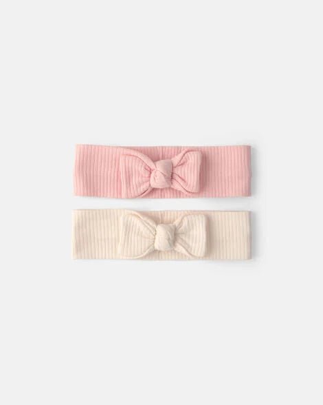 Set de diademas para bebé Carter's, una rosa y otra marfil, con lazo decorativo y textura acanalada.