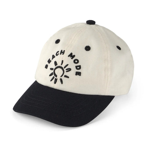 Gorra Carter's bicolor crema y negra para bebé con bordado 'Beach Mode' y diseño de sol.